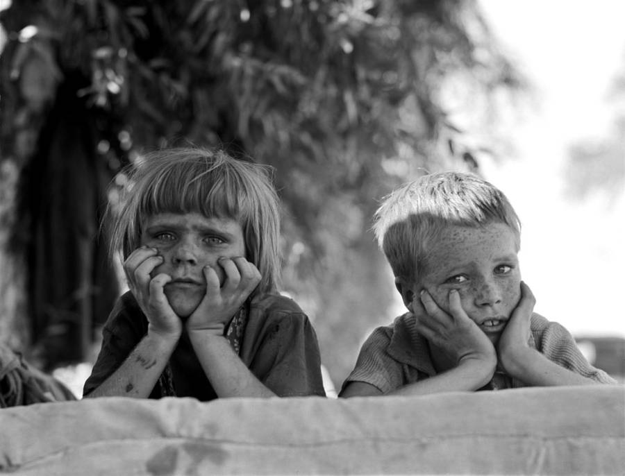 Children With Faces In Hands