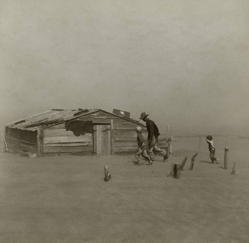 Family Walking Through Storm