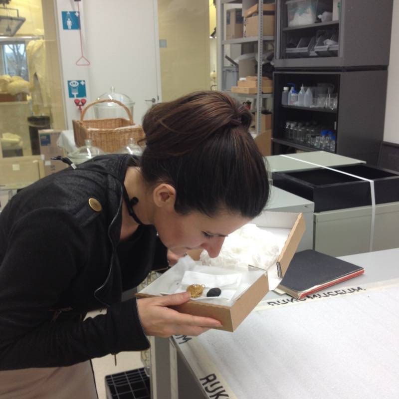 Researcher Sniffing Box
