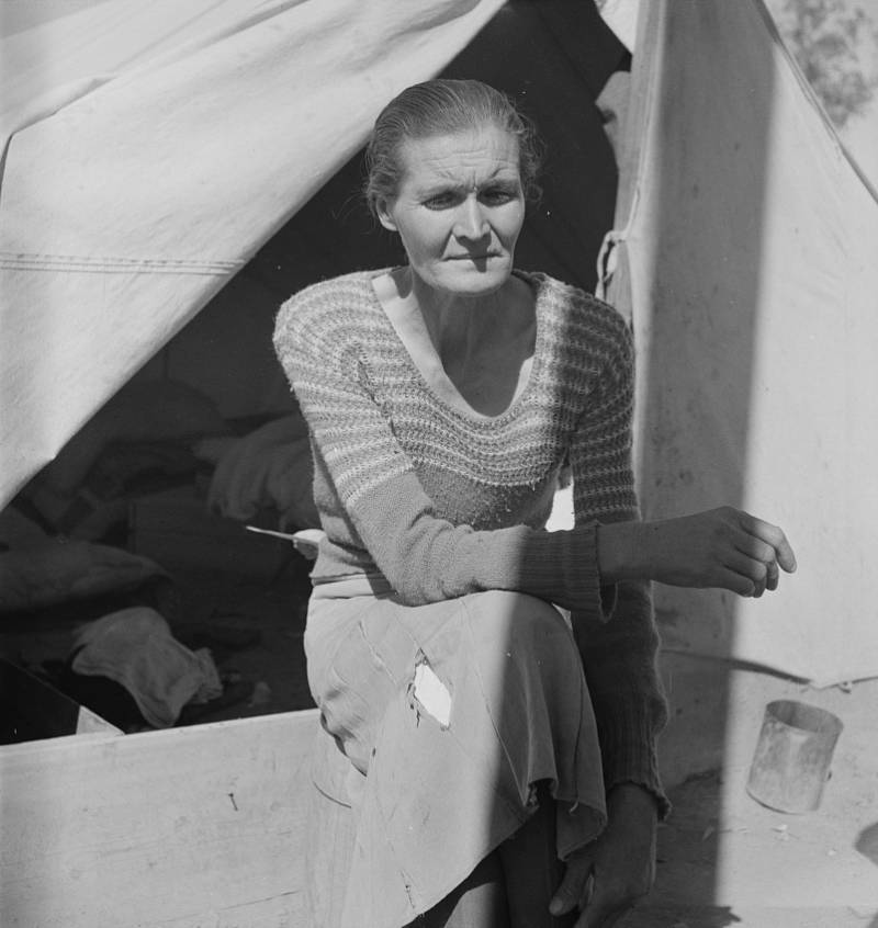 Woman Sitting Near Tent