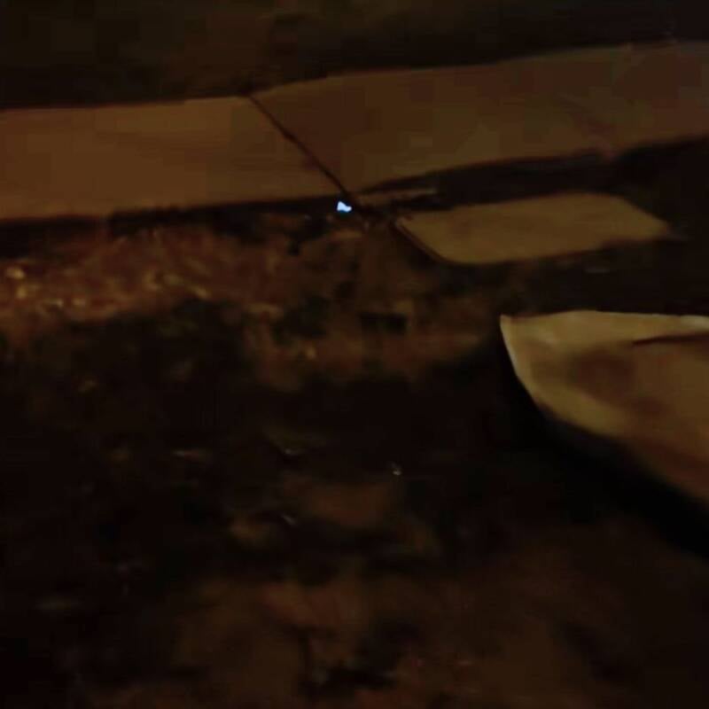 Light Glowing Through Sidewalk