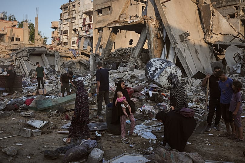Palestinians in rubble