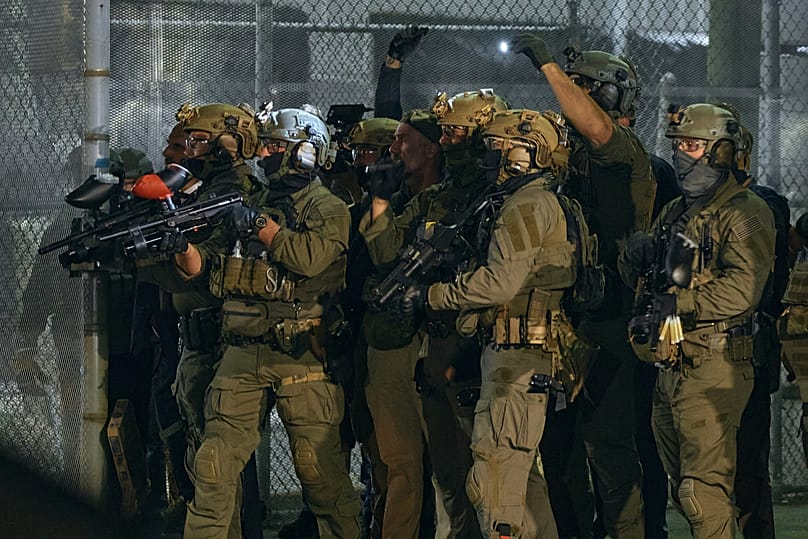 ICE agents during protest