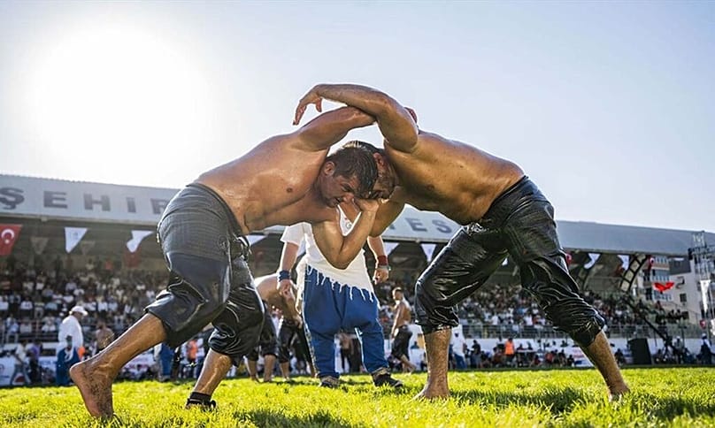 Two fighters engage in hand to hand combat
