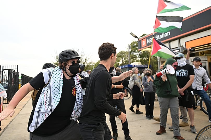 Pro Palestinian protesters, right, march past counter protesters during a protest before an Ed Sheeran concert in Philadelphia, Saturday, Sept. 19, 2026