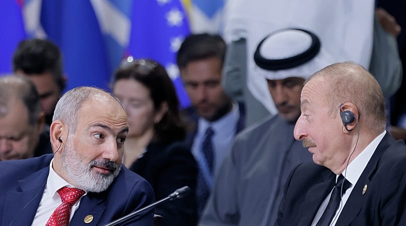 Armenian Prime Minister Nikol Pashinyan, left, and Azerbaijani President Ilham Aliyev attend Outreach/BRICS Plus format session at the BRICS Summit