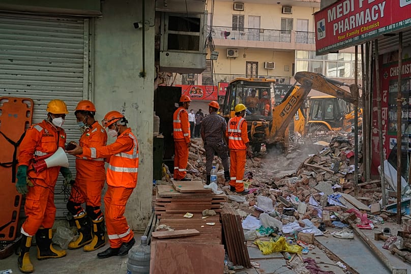 Rescue workers search for survivors
