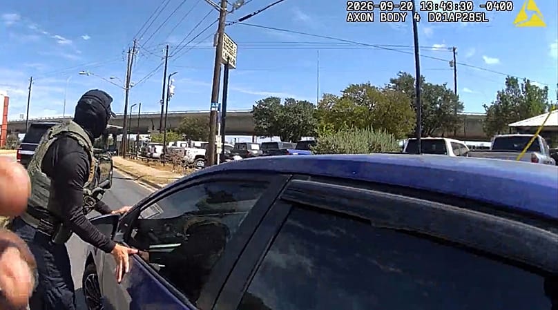 ICE officer stopping a vehicle