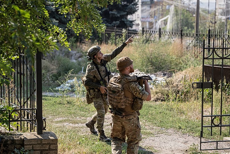 Ukrainian servicemen watch a first-person-view (FPV) drone in Druzhkivka on 12 September 2026.